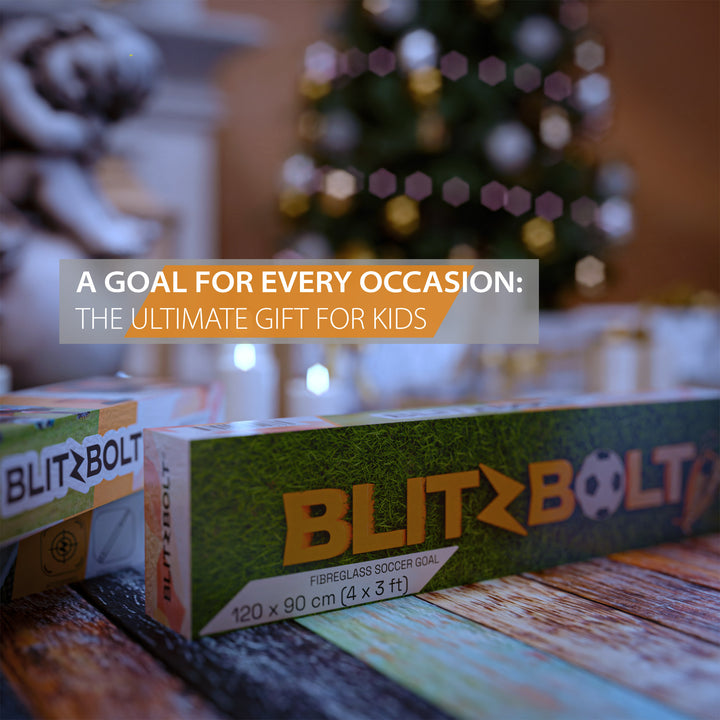 A BlitzBolt pop-up soccer goal package, with a Christmas tree and decoration around it.